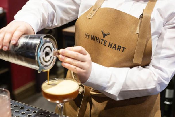 Bar staff pouring cocktails at The White Hart